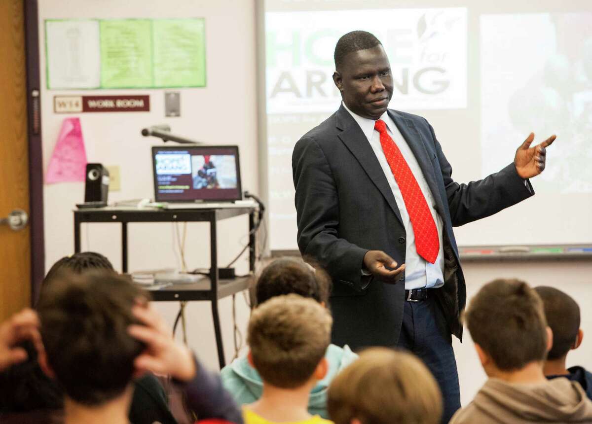 Gabirel Bol Deng one of the "Lost Boys of Sudan" speaks to students at Western middle school, Greenwich, CT on Wednesday, November, 20th, 2013.