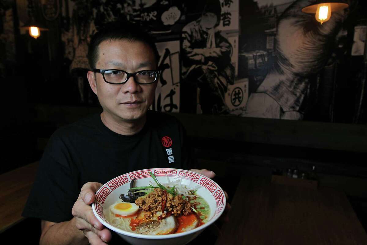 Mike Tran, the co-owner of new Chinatown restaurant Tiger Den, dishes out four varieties of ramen, including tantan ramen with pork.