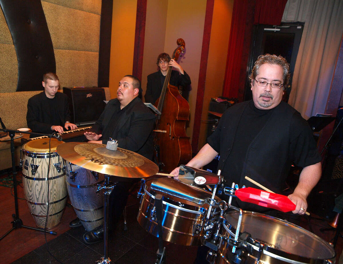 Henry Brun (right) & the Latin Playerz will be among the bands playing Saturday at Sam Ash Music Store for its in-store toy drive and concert.