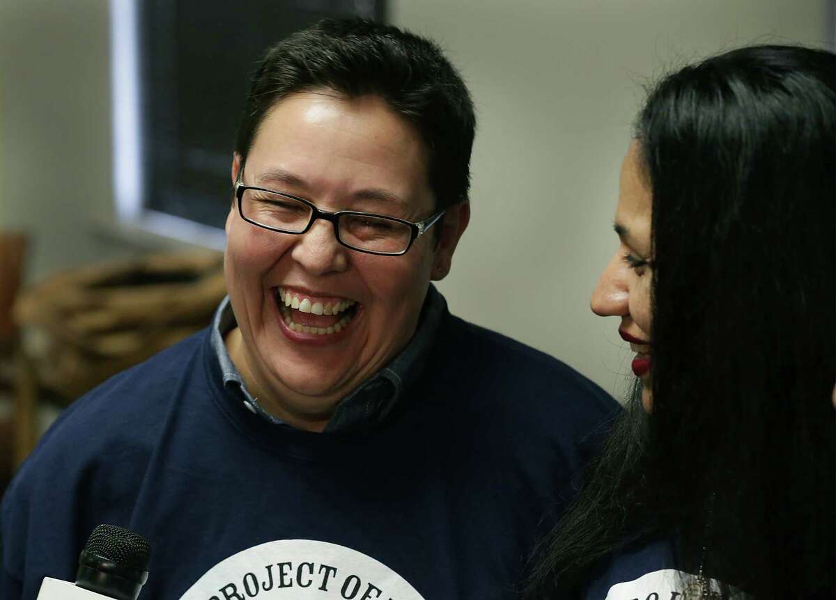 Kristie Mayhugh, left, smiles as she and Cassandra Rivera are interviewed during a press conference with their lawyers in the Tower Life Building. Wednesday, Nov. 20, 2013. The four are known as the SA 4.