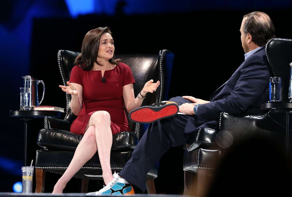 SAN FRANCISCO, CA - NOVEMBER 20: Facebook COO Sheryl Sandberg (L) participates in a conversation with Salesforce chairman and CEO Marc Benioff (R) at the 2013 Dreamforce conference on November 20, 2013 in San Francisco, California. The annual Dreamforce conference runs through November 21. (Photo by Justin Sullivan/Getty Images)