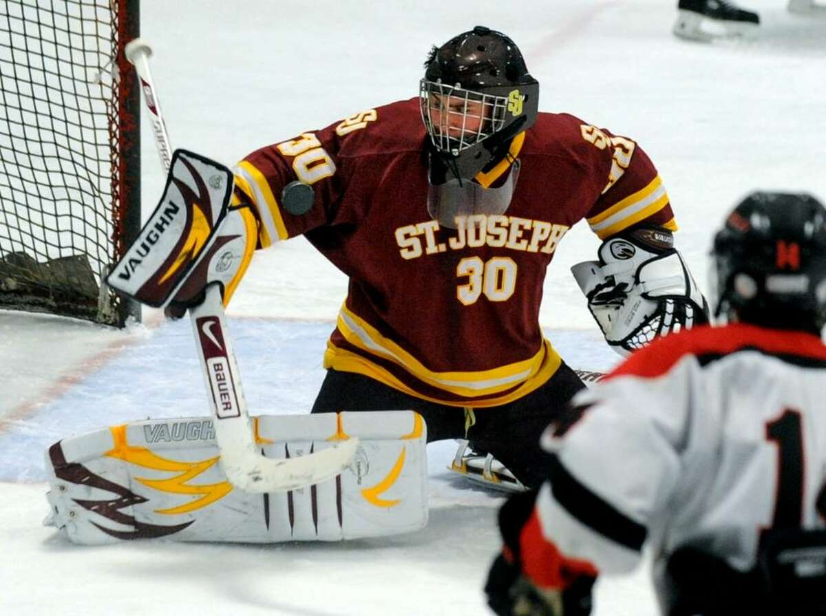 St. Joseph's goalie Zack Carrano deflects a Fairfield goal attempt, during game action at the Wonderland of Ice rink in Bridgeport, Conn. on Saturday Jan. 30, 2010.
