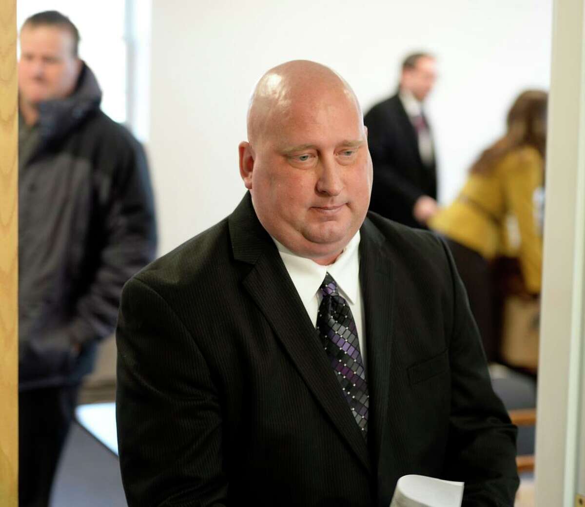 Albany Police Officer Brian Lutz leaves Menands Town Court after his sentencing on a DWAI charge on Thursday, Nov. 21, 2013. (Skip Dickstein/Times Union)