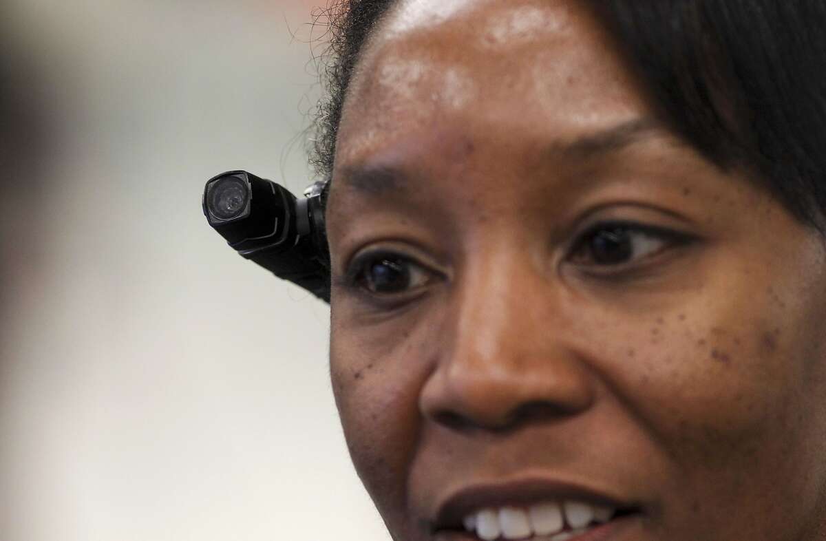 Sergeant Tanzanika Carter with the BART police force, wears the Axon Taser Flex video camera while on patrol in the Powell Street BART station in San Francisco, Ca., on Wednesday Nov. 20, 2013. San Francisco Police officers will also start using the body mounted video cameras very soon.