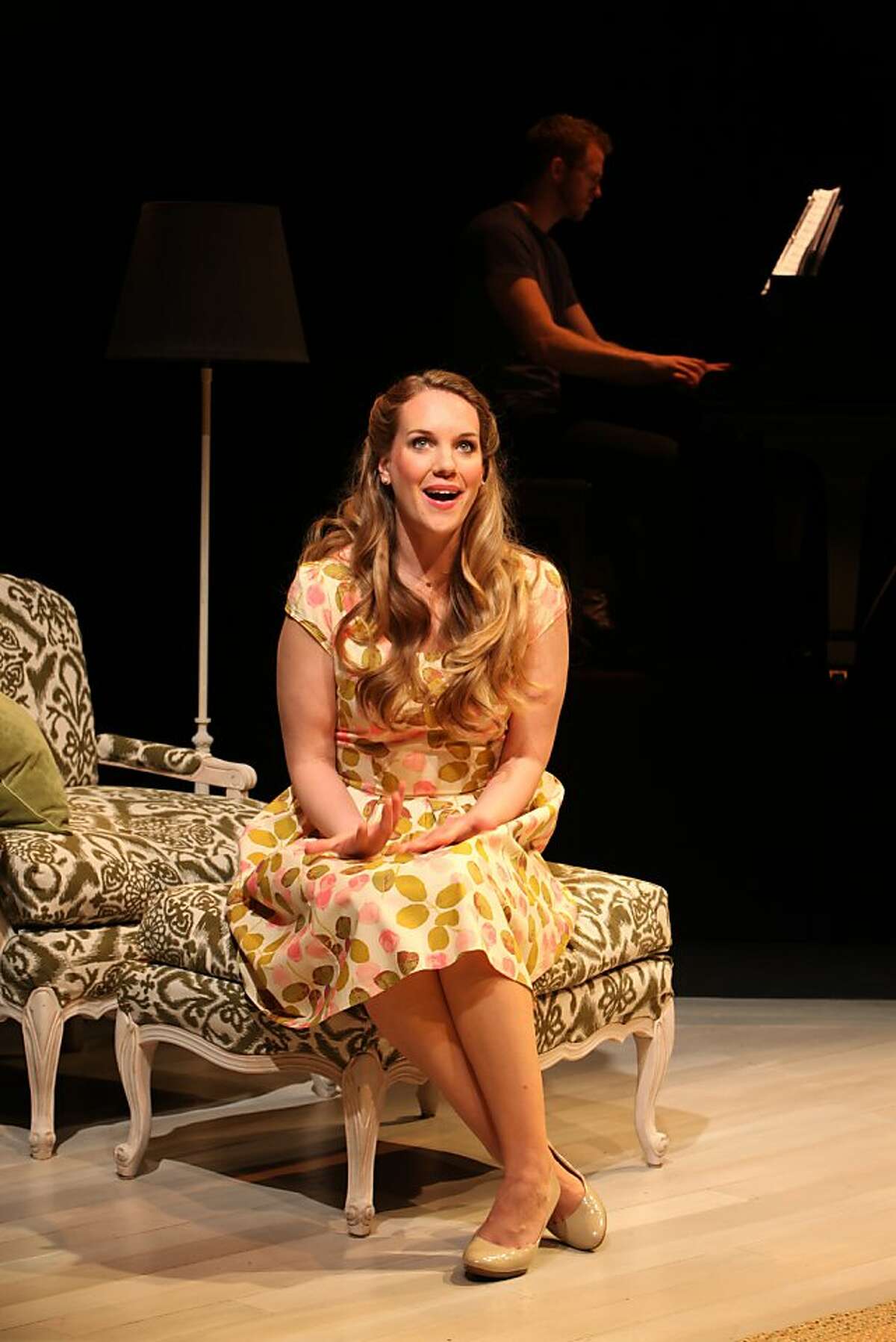 Analisa Leaming as Sara Jane, a wife trying to make the best of things while her husband is at war, in the world premiere musical "Arlington" at Magic Theatre. (pianist in background is Jeff Pew)