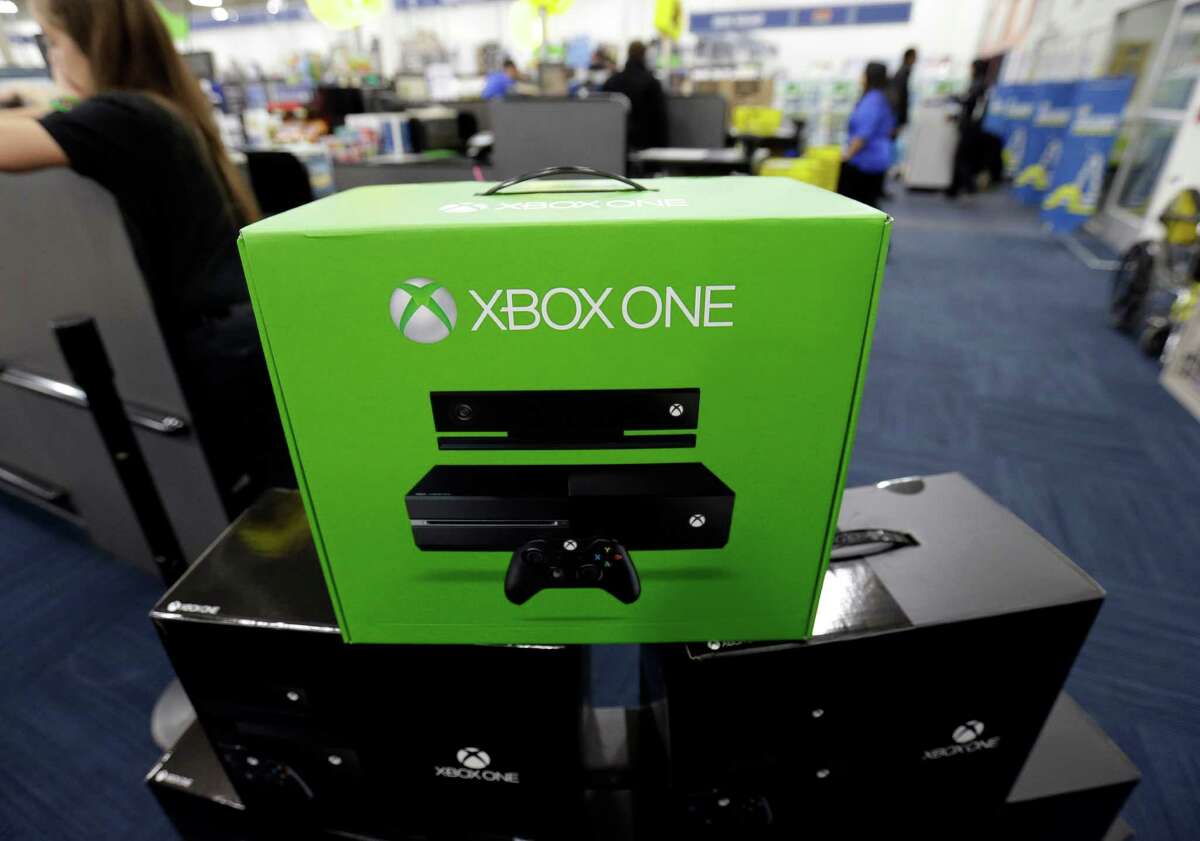 The Xbox One is on display at a Best Buy store on Friday, Nov. 22, 2013., in Evanston, Ill. Microsoft is billing the Xbox One, which includes an updated Kinect motion sensor, as an all-in-one entertainment system rather than just a gaming console. (AP Photo/Nam Y. Huh)