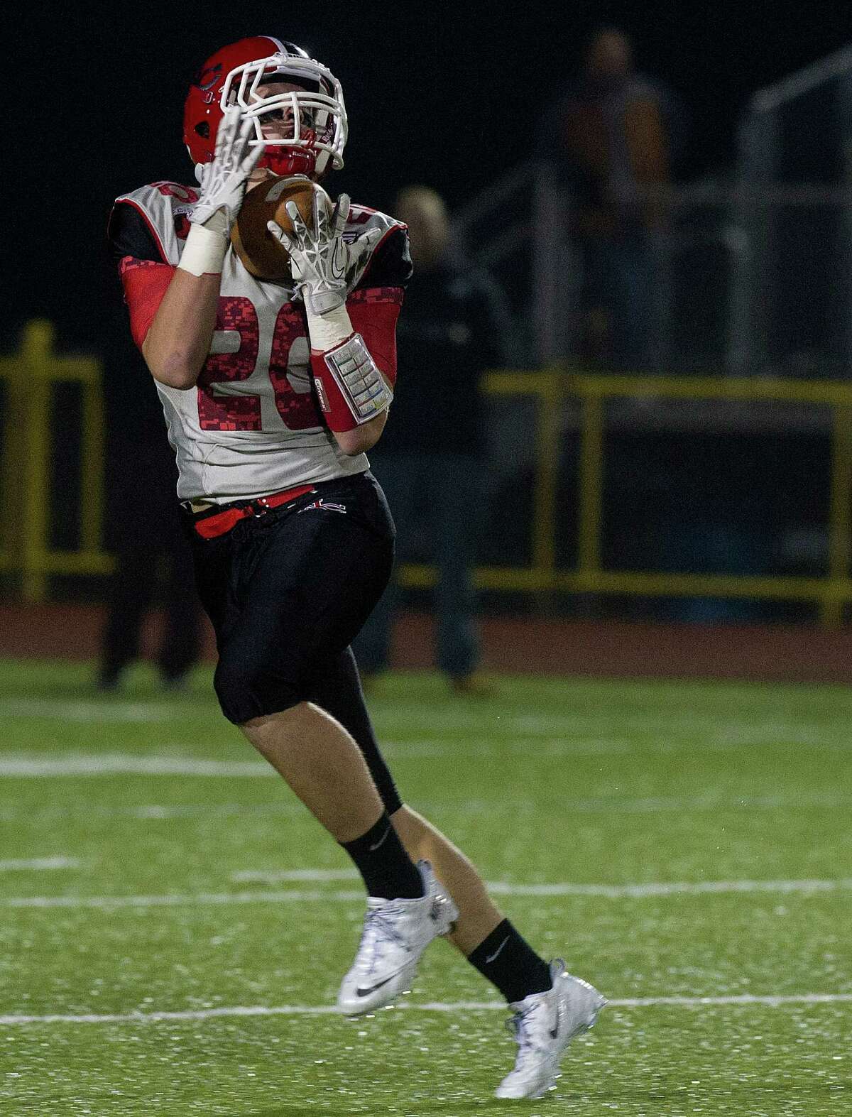 New Canaan's Kyle Smith makes a catch and runs for a touchdown during Friday's FCIAC championship game at Trumbull High School on November 22, 2013.
