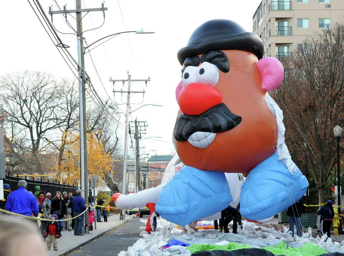 The Mr. Potato Head balloon gets inflated with helium during the annual SAC Capital Advisors balloon inflation party on Franklin Street in Stamford, Saturday afternoon, Nov. 23, 2013. The UBS Parade Spectacular begins at noon on Sunday, Nov. 24, at Summer and Hoyt streets and ends at Federal Street.