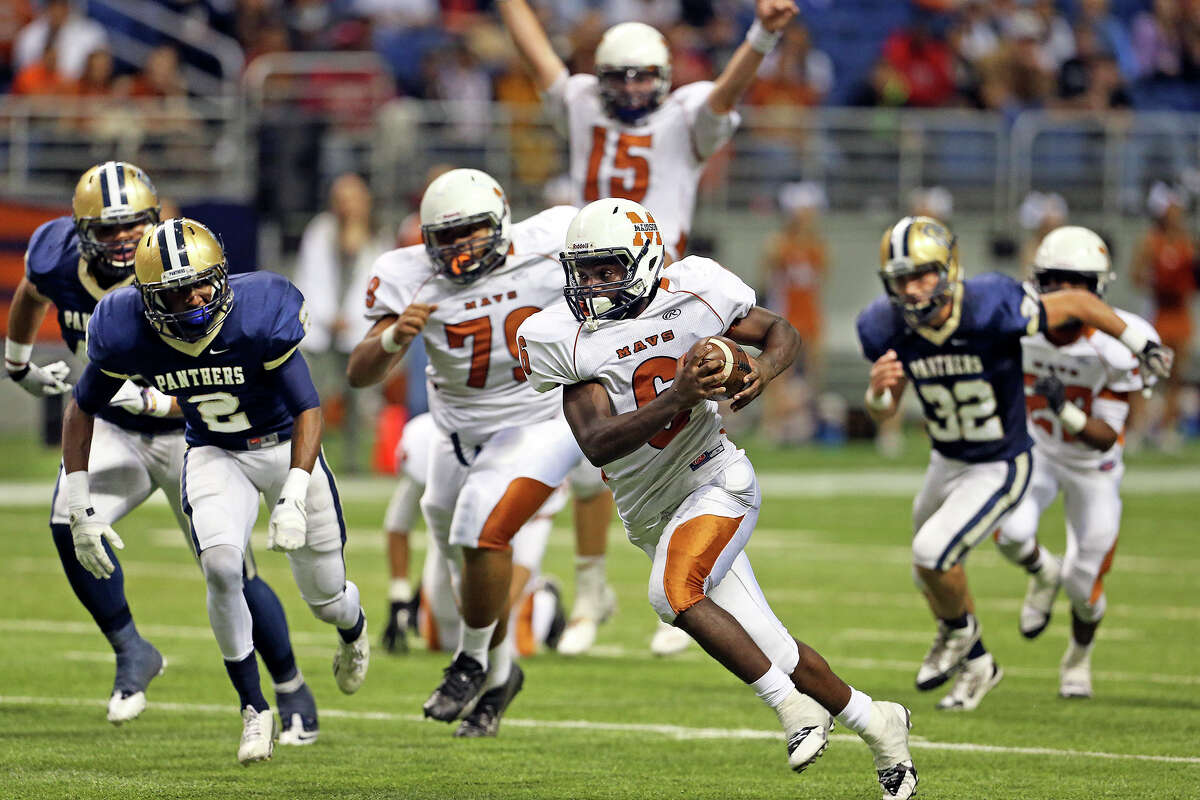 Dominique Daniels streaks for the end zone in the third quarter with quarterback Cody Ennis already celebrating the touchdown as Madison plays O'Connor in second round 5A football playoffs at the Alamodome on November 23, 2013.