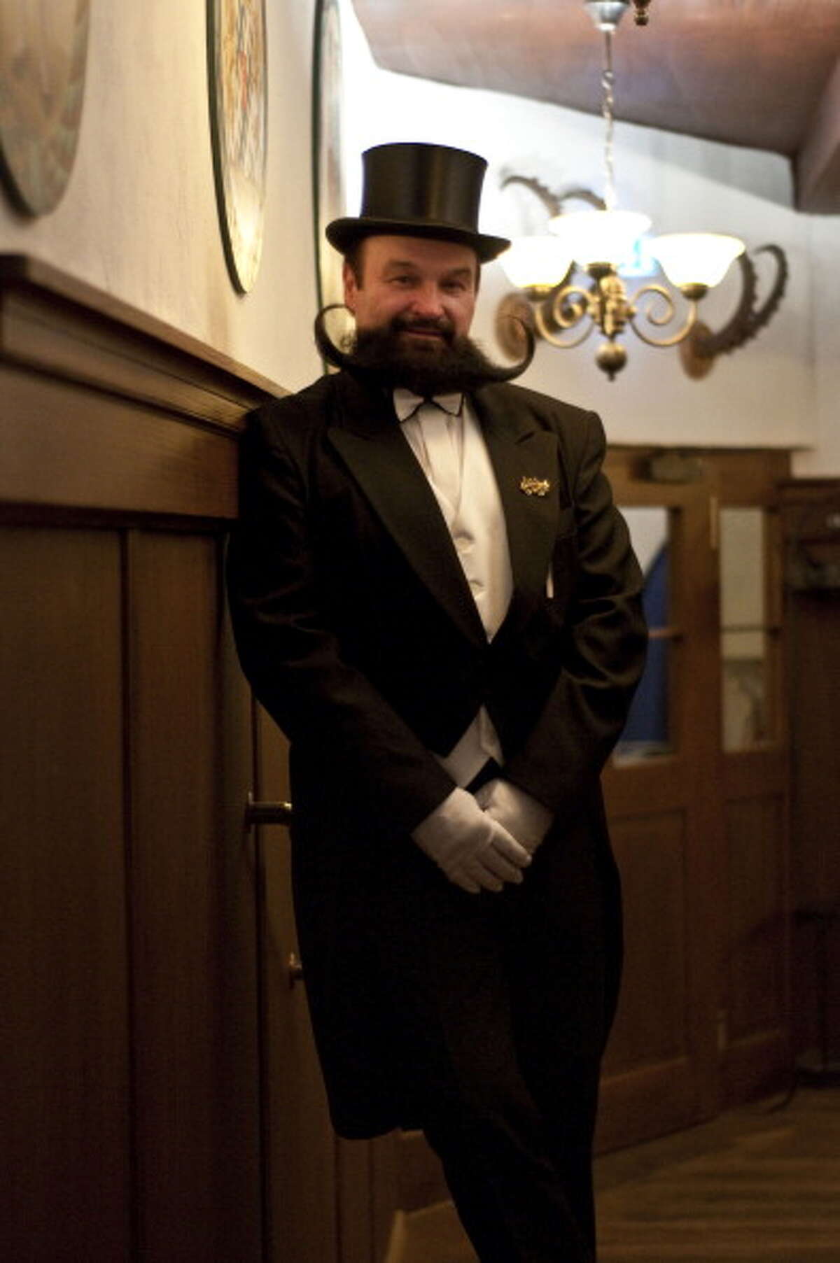 GARMISCH PARTENKIRCHEN, GERMANY - MARCH 26, 2011: Contestant of the Beard Championship held in Garmisch Partenkirchen posing in tailcoat and tophat, Germany.