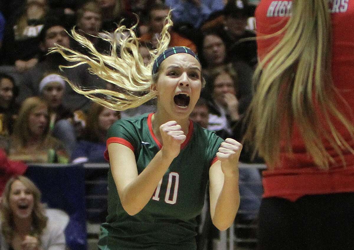 The Woodlands' Kelly Quinn (10) celebrates a point during a Class 5A UIL Volleyball State Championship game Saturday, Nov. 23, 2013, in Garland, Texas. The Woodlands defeated San Antonio Churchill in straight sets to became the 18th undefeated volleyball state champion in UIL history since 1967. (AP Photo/ The Courier, Jason Fochtman)