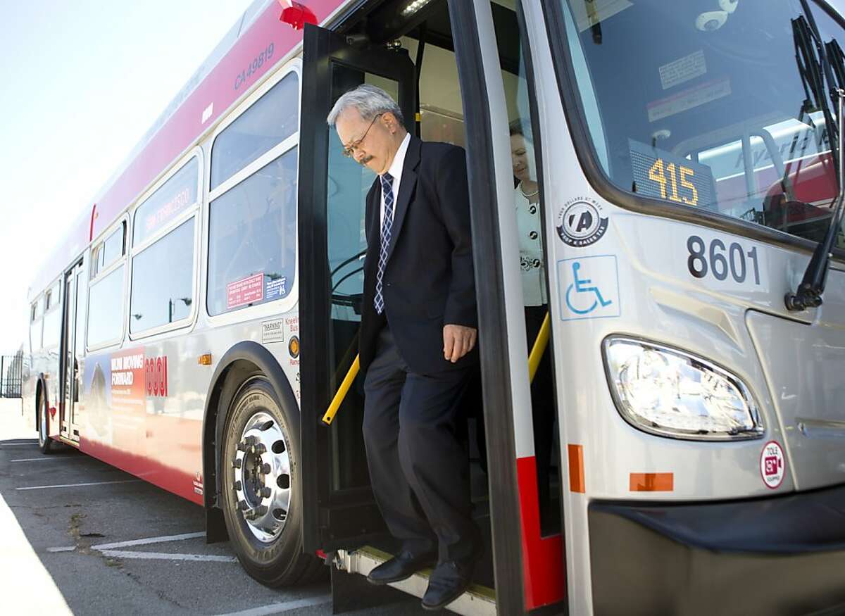 Mayor Ed Lee rides one of Muni's new bio-diesel hybrid buses to City Hall Monday, June 17, 2013 in San Francisco, Calif.