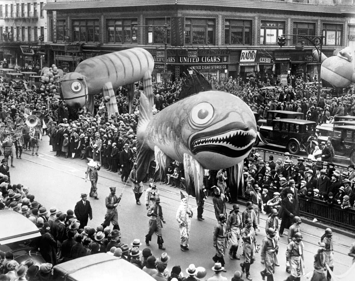 Part of the Macy's Thanksgiving Day Parade that officially brings Santa Claus into New York City is seen circa 1929. The Fish Balloon is 35 feet long, while the Tiger Balloon is 60 feet long. At the end of the parade, the balloons were released, with a $100 prize awarded for each one recovered and returned to Macy's.