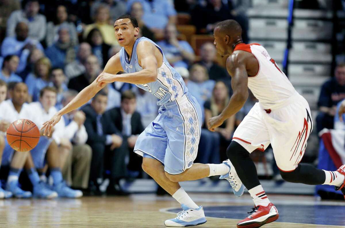 File photo of Marcus Paige leading the way with a team-high 32 points as North Carolina topped Louisville 93-84.