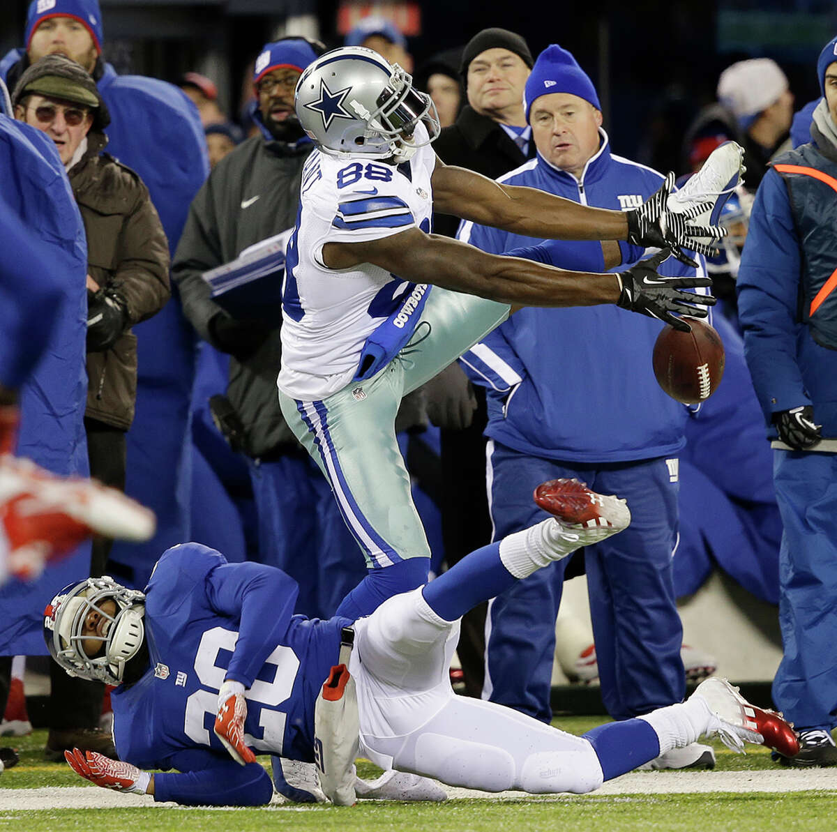 Dallas Cowboys wide receiver Dez Bryant, top, is unable to catch a pass from quarterback Tony Romo as New York Giants cornerback Prince Amukamara (20) defends on the play during the second half of an NFL football game, Sunday, Nov. 24, 2013, in East Rutherford, N.J. (AP Photo/Seth Wenig)