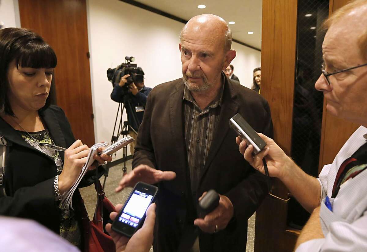 FILE -- In this Nov. 8, 2013 file photo, John Tos, a Hanford farmer and the lead plaintiff in a lawsuit to block the sale of bonds to build California's bullet train, talks with reporters after a hearing in the case in Sacramento County Superior Court in Sacramento, Calif. Sacramento County Superior Court Judge Michael Kenny ruled in favor of the opponents, Monday, Nov. 25, 2013, when he rejected a request from the California High-Speed Rail Authority to sell $8 billion of the $10 billion in bonds approved by voters in 2008. In a separate suit he also ordered the rail authority to redo its $68 billion funding plan before continuing construction. (AP Photo/Rich Pedroncelli, file)