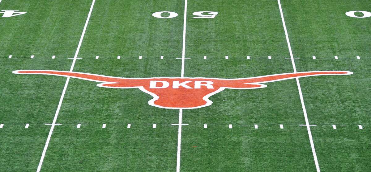 The initials of former Texas football coach Darrell K. Royal were painted inside the longhorn logo on the field at Darrell K. Royal-Memorial Stadium, Saturday, Nov. 10, 2012, in Austin, Texas. The initials were added in honor of Royal who passed away on Wednesday. (AP Photo/Michael Thomas)