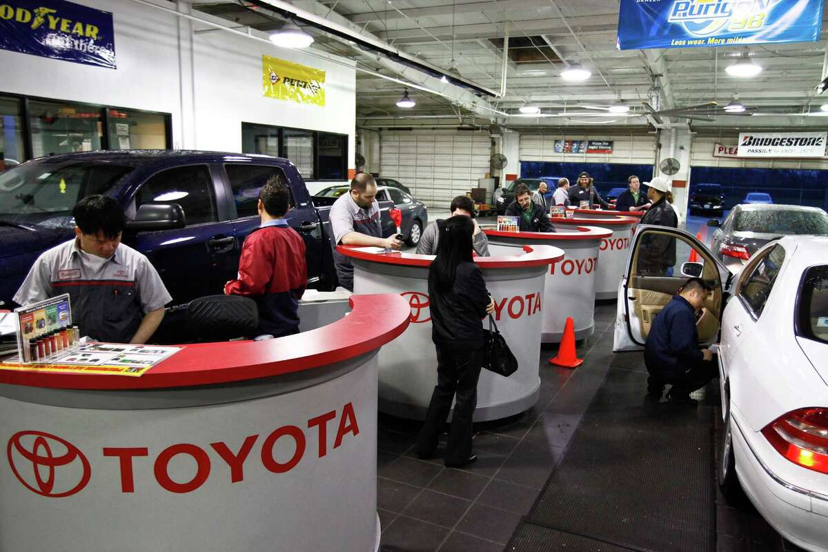 Toyota automotive technicians help customers at Sterling McCall Toyota Wednesday, Feb. 3, 2010, in Houston.