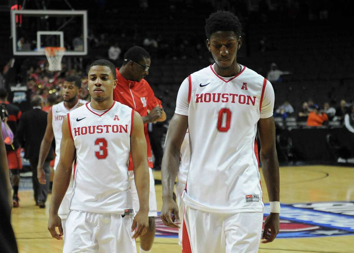 NEW YORK, NY - NOVEMBER 26: Jaaron Simmons #3 and Danrad Knowles #0 of the Houston Cougars walk off the court after their game against the Texas Tech Red Raiders at Barclays Center on November 26, 2013 in the Brooklyn borough of New York City.