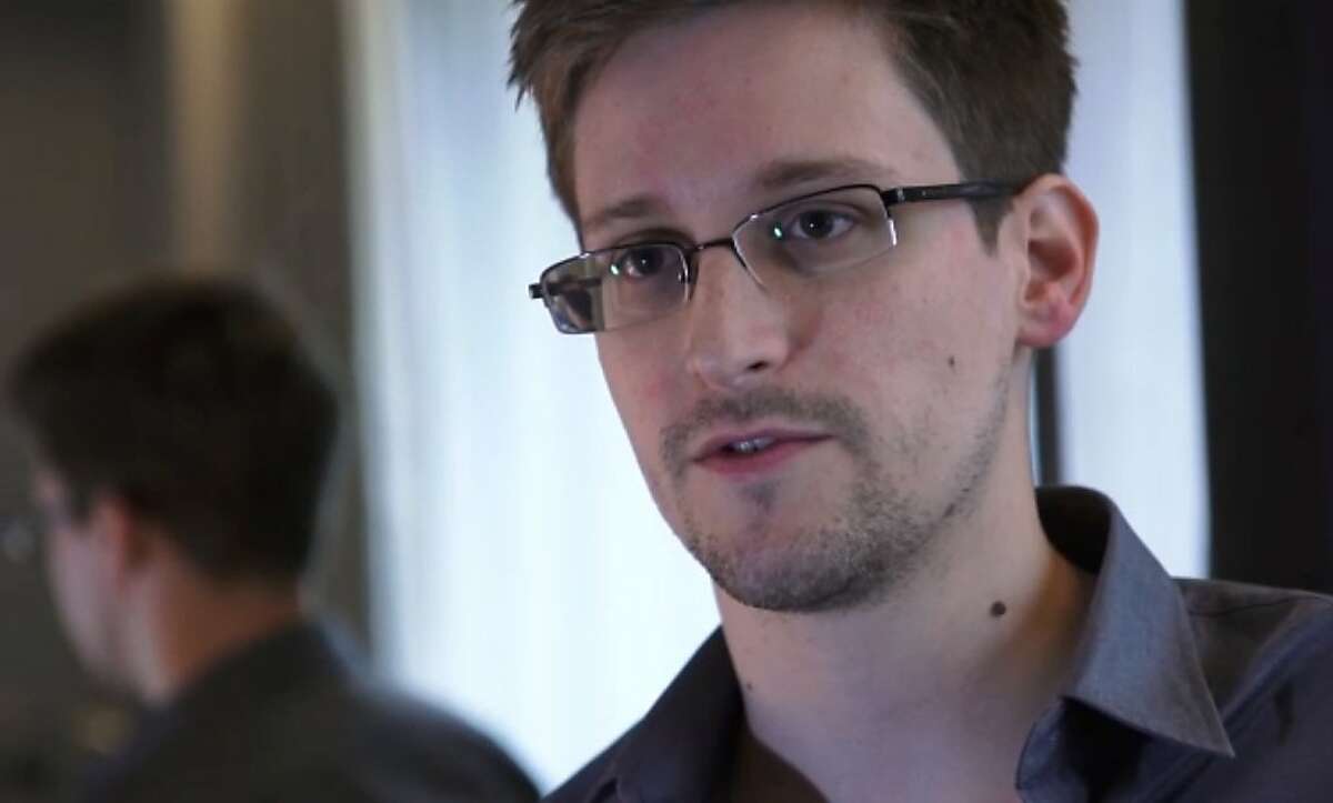 -- AFP PICTURES OF THE YEAR 2013 -- ---EDITORS NOTE--- RESTRICTED TO EDITORIAL USE - MANDATORY CREDIT "AFP PHOTO / THE GUARDIAN" - NO MARKETING NO ADVERTISING CAMPAIGNS - DISTRIBUTED AS A SERVICE TO CLIENTS This still frame grab recorded on June 6, 2013 and released to AFP on June 10, 2013 shows Edward Snowden, who has been working at the National Security Agency for the past four years, speaking during an interview with The Guardian newspaper at an undisclosed location in Hong Kong. The 29-year-old government contractor revealed himself as the source behind bombshell leaks of US monitoring of Internet users and phone records, as US intelligence pressed for a criminal probe. Snowden, who has been working at the National Security Agency for the past four years, admitted his role in a video interview posted on the website of The Guardian, the first newspaper to publish the leaked information. TOPSHOTS / AFP PHOTO / THE GUARDIAN The Guardian/AFP/Getty Images