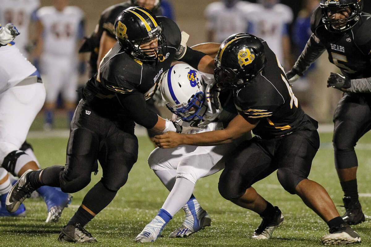 Troy Irby (left) and Evan Ferguson (right), making a tackle against Clemens, are part of Brennan's astounding defense.