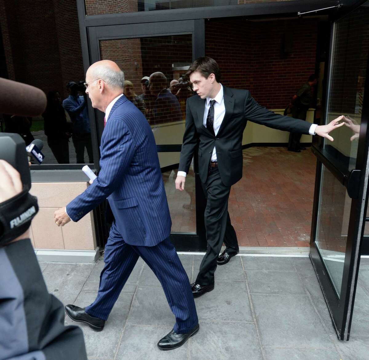 Dennis Drue, right accompanied by his defense attorney Steve Coffey leaves Saratoga County Courthouse where he took a plea deal Sept. 27, 2013, in Ballston Spa, N.Y. (Skip Dickstein/Times Union)