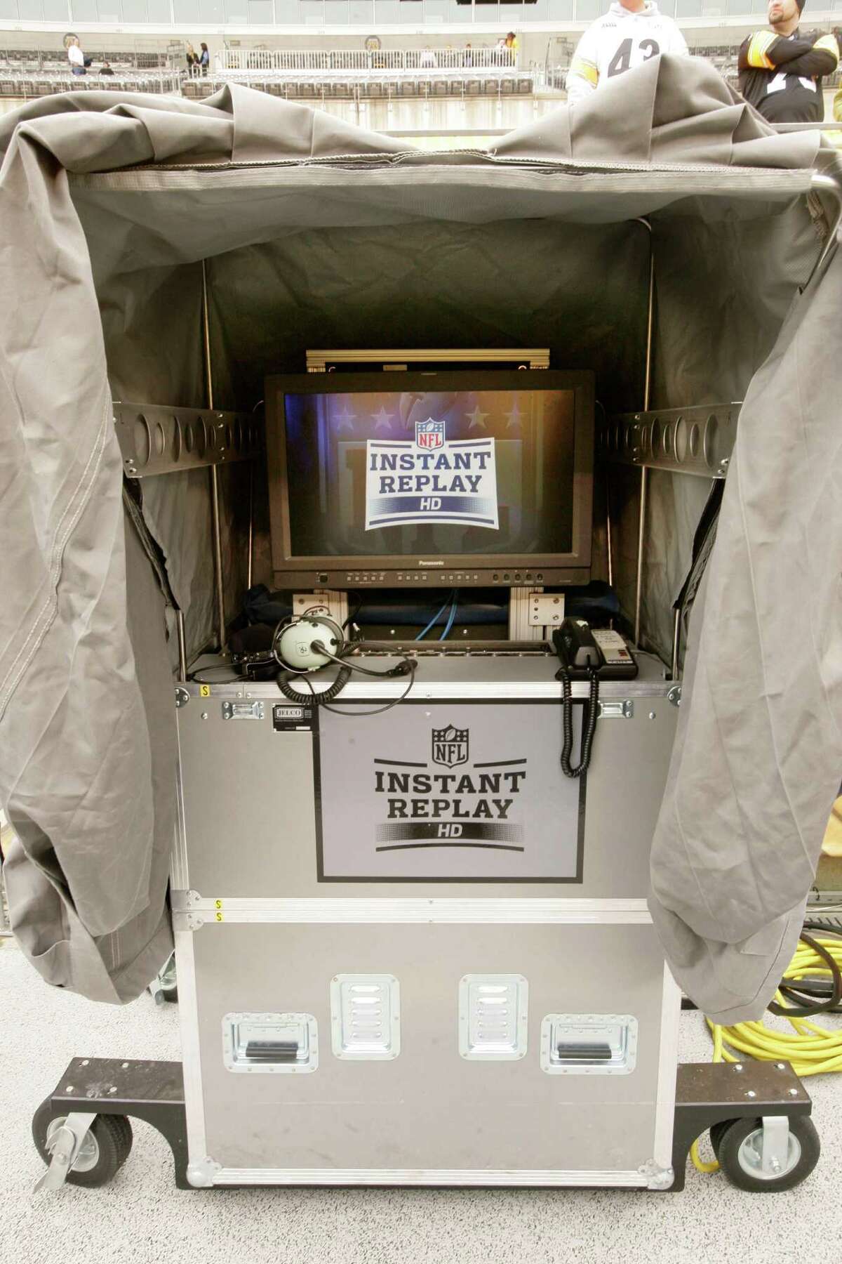The instant replay booth on the sideline at Pittsburgh's Heinz Field is seen before an NFL football game. Reviewing NFL plays is a high-tech job that's growing in importance now that the NFL reviews every score.