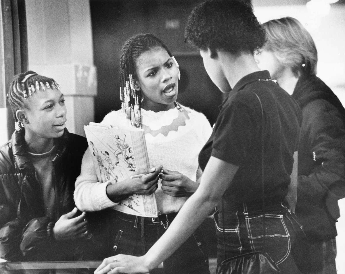 This archive photo of Franklin students had no legible date, but that Pee Chee folder dates it to possibly the awesome '80s. Pictured are freshmen Renee Jordan, left, and Kim Gross talking to friends.