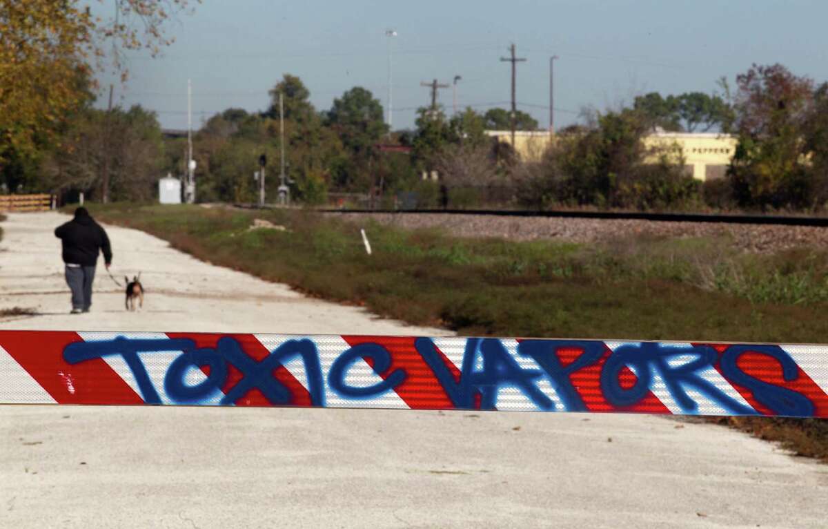 Graffiti marks a barrier on Cavalcade near a former wood treatment facility that was declared a Superfund site in 1984.