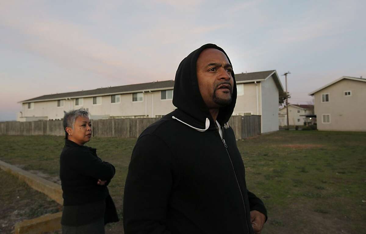 Paris and Lucinda Hayes at the lot behind their Treasure Island home in San Francisco, Ca., on Monday Dec. 2, 2013. About 24 households, including that of 10-year Treasure Island residents Paris and Lucinda Hayes, are going to be relocated so that the Navy can do toxic cleanup work in and around the buildings.
