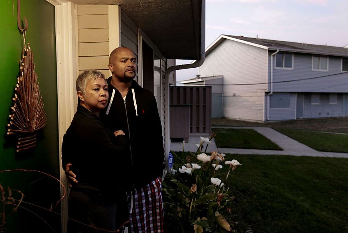 Lucinda and Paris Hayes at the front door of their Treasure Island home in San Francisco, Ca., on Monday Dec. 2, 2013. About 24 households, including that of 10-year Treasure Island residents Paris and Lucinda Hayes, are going to be relocated so that the Navy can do toxic cleanup work in and around the buildings.