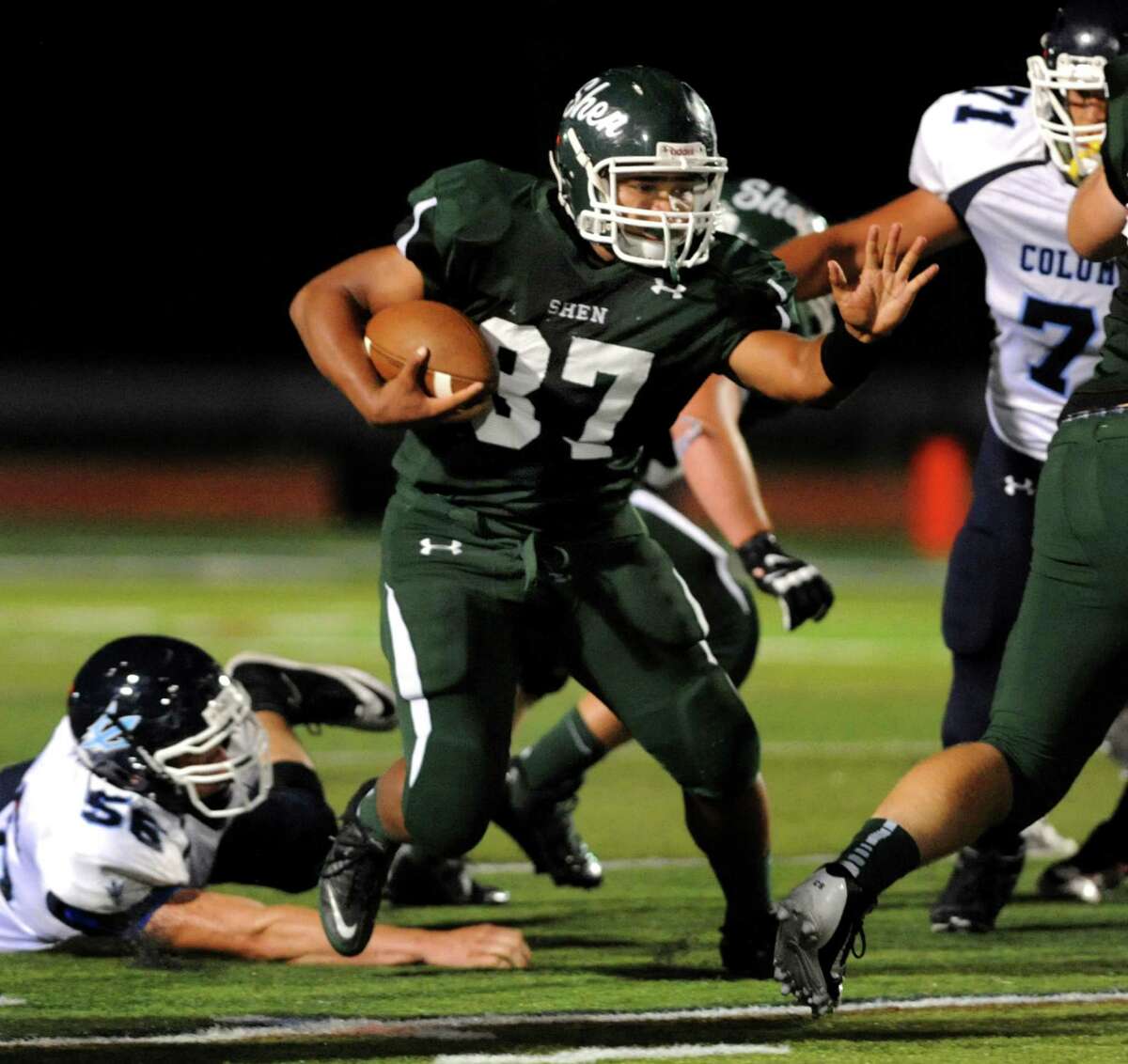 Shenendehowa's Oliver Robinson, center, gains yards during their football game against Columbia on Friday, Sept. 6, 2013, at Shenendehowa High in Clifton Park, N.Y. (Cindy Schultz / Times Union)