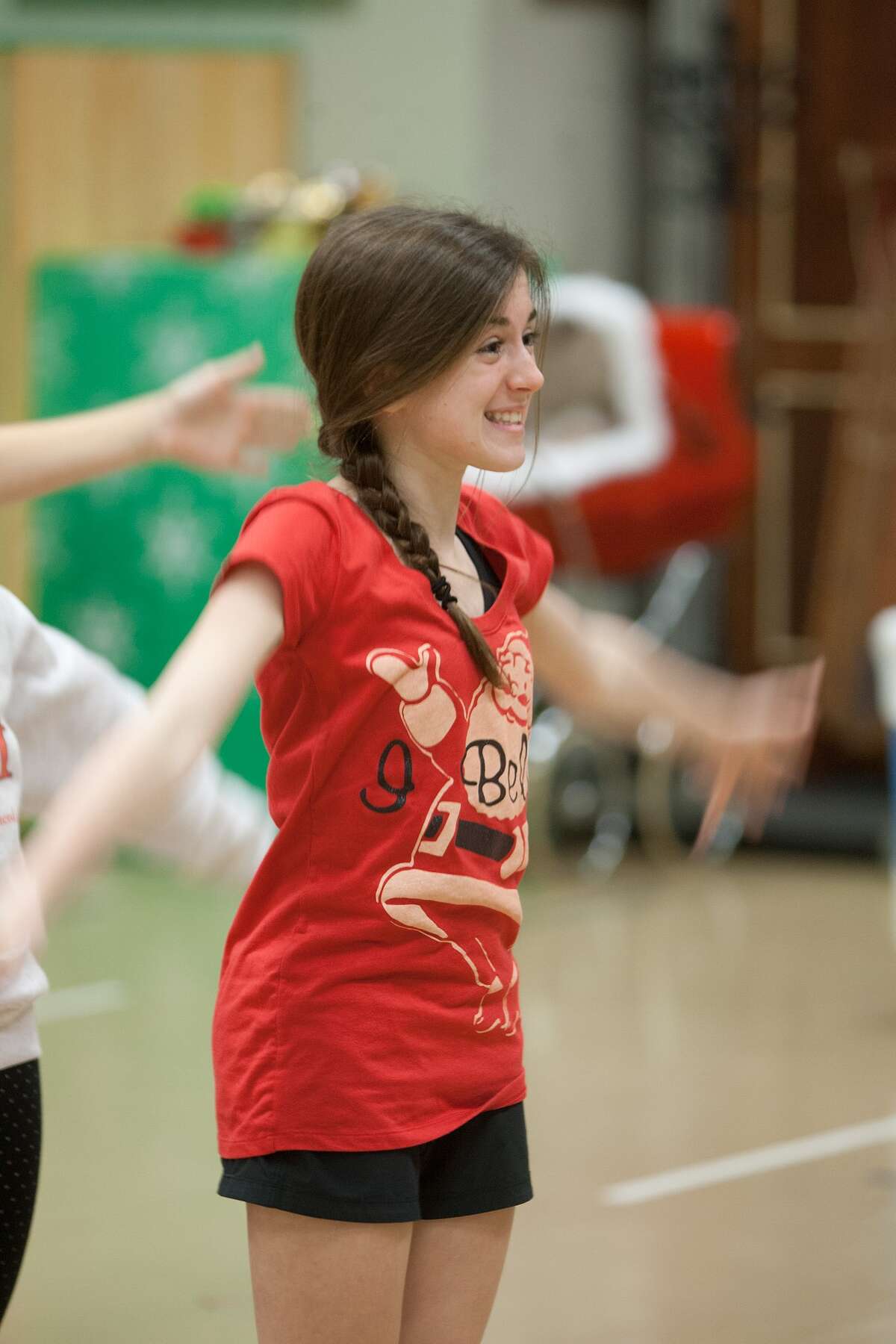 Lauren Dodds practices a dance during rehearsal for the TUTS production of "Elf."
