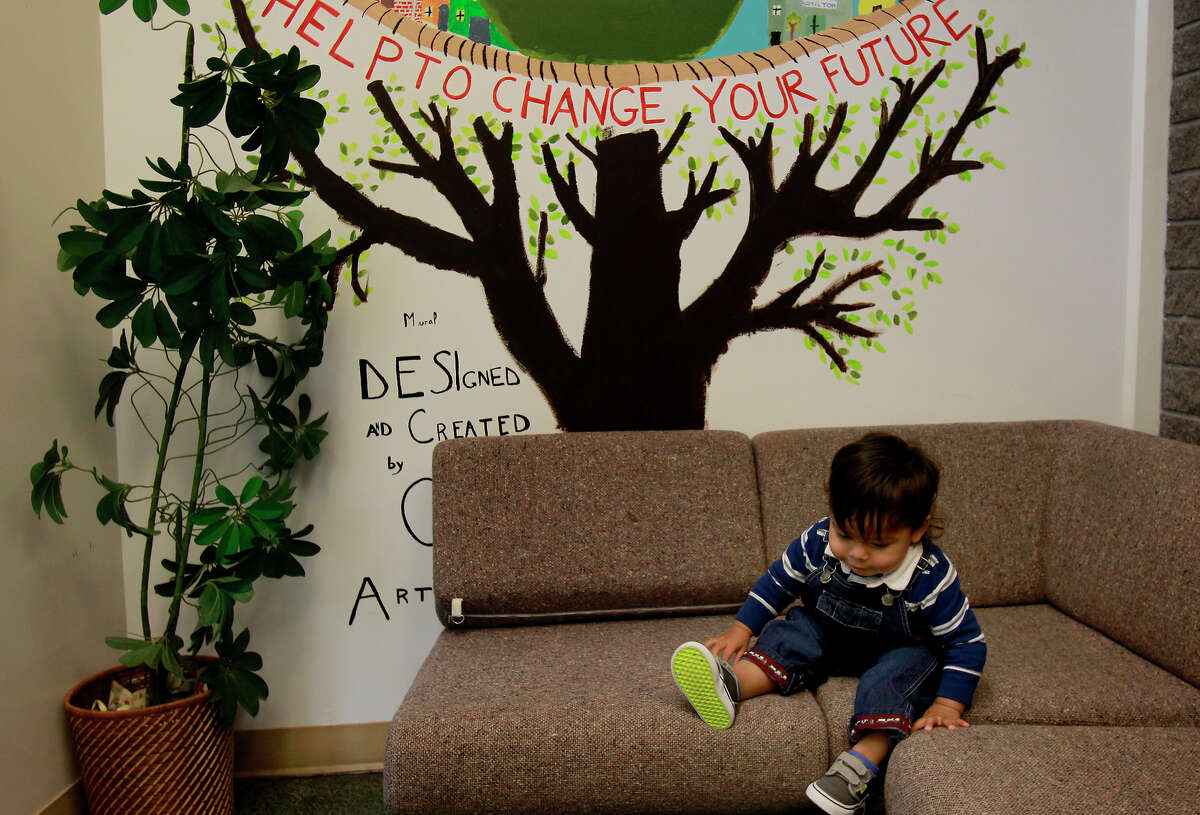 A child plays on a couch at the Hamilton Family Center in San Francisco.