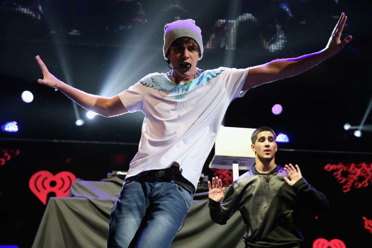 DALLAS, TX - DECEMBER 02: Recording artist Austin Mahone performs onstage during 106.1 KISS FM’s Jingle Ball 2013 at American Airlines Center on December 2, 2013 in Dallas, Texas.