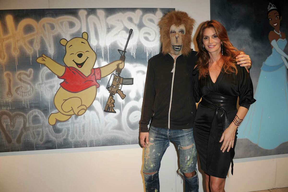 MIAMI, FL - DECEMBER 03: (L-R) Artist Herr Nilsson and Cindy Crawford attends Art Miami on December 3, 2013 in Miami, Florida.