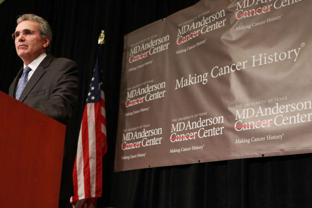 Dr. Ron DePinho, president of the University of Texas M.D. Anderson Cancer Center, speaks at a news conference in 2012. DePinho's dismissal of  two longtime professors triggered an inquiry over the institution's tenure policy. ( Johnny Hanson / Houston Chronicle )