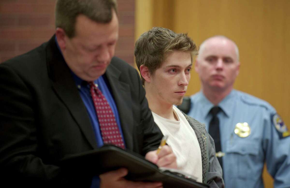 Alexander Lee, 21, appears in superior court in Danbury, Conn, on Wednesday , December 4, 2013,for his arraignment on charges he fled the scene after a cyclist from Weston hit his car on Route 302 in Bethel earlier this year. He was held on $150,000 bail. On left is his attorney Kevin P. Chamberlin.