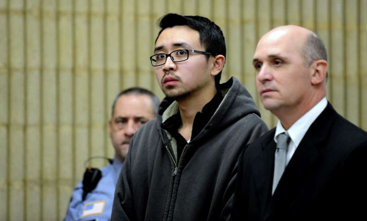 University of New Haven student William Dong, 22, of Fairfield, with Assistant Public Defender Kevin Williams, is arraigned Wednesday, Dec. 4, 2013 at Superior Court in Milford, Conn. on weapons charges following an incident at the University of New Haven.