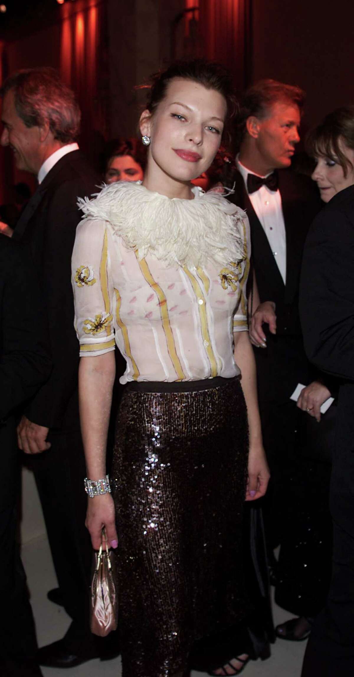 2000: Milla Jovovich at the cocktail party prior to Victoria's Secret Fashion Show at the amfAR/Cinema Against Aids 2000 benefit at the Cannes Film Festival.