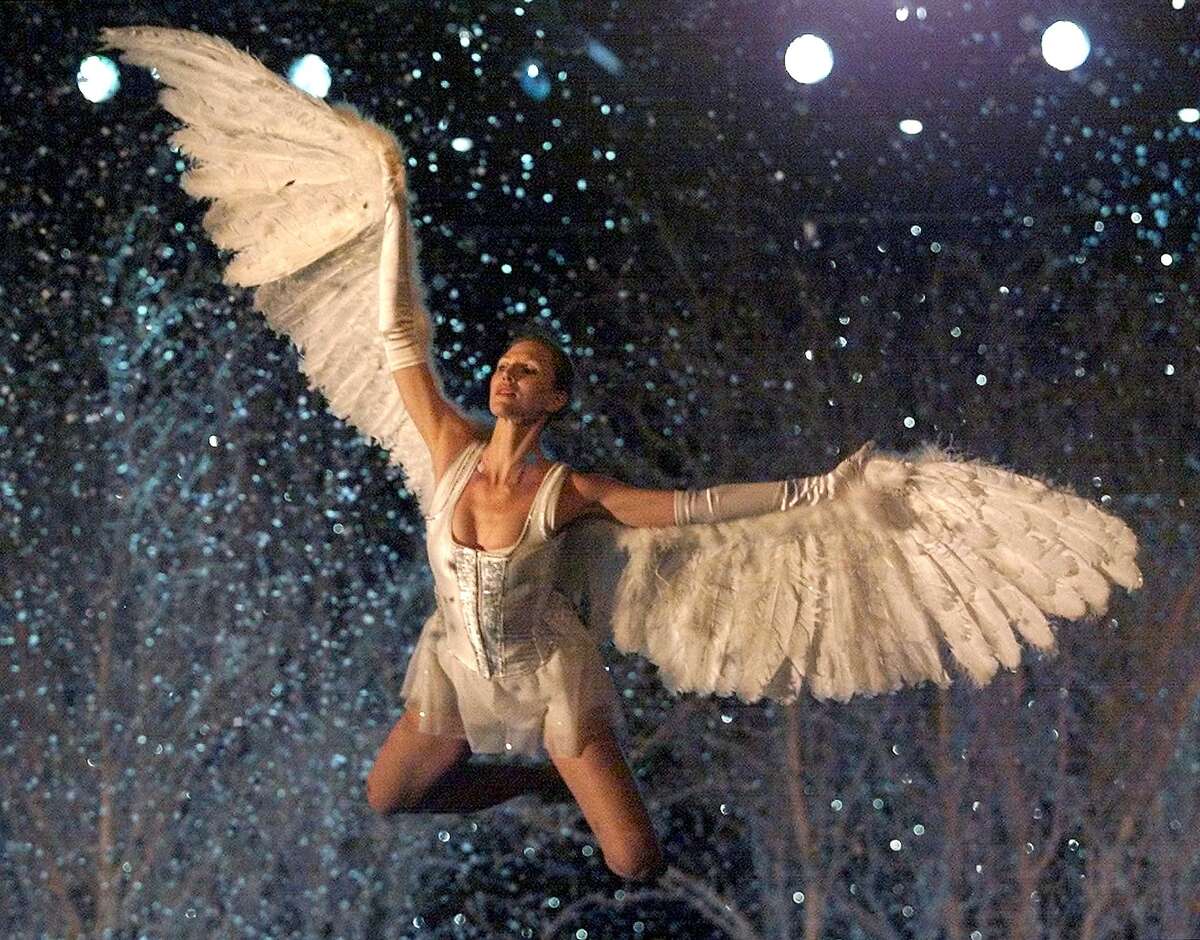 2001: A model dressed as a Angel enters the stage during the Victoria's Secret Fashion Show in Bryant Park 13 November 2001.