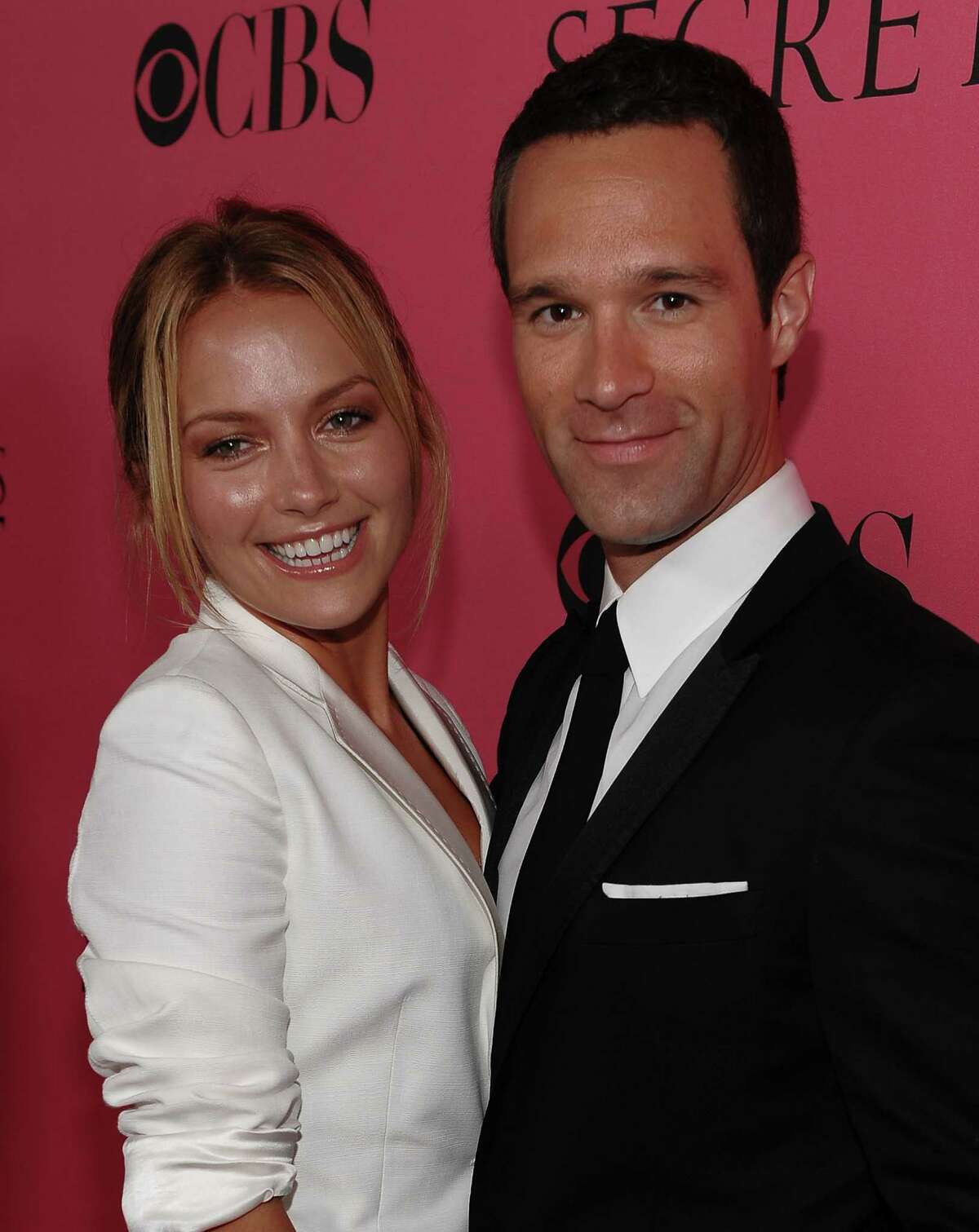 2008: Becky Newton and Chris Diamantopoulos arrives to the 2008 Victoria's Secret Fashion Show at the Fontainebleau Hotel on November 15, 2008 in Miami Beach, Florida. (Photo by Dimitrios Kambouris/WireImage)