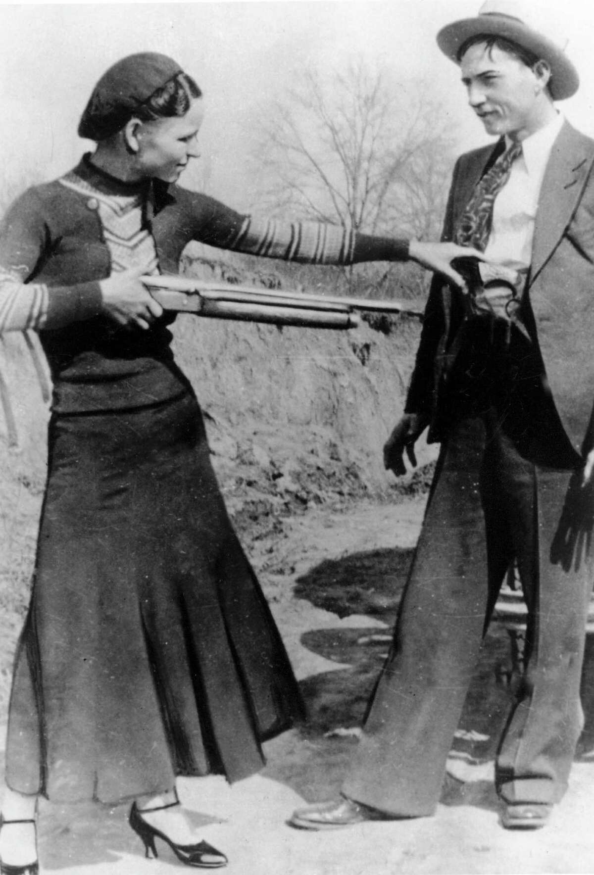 FILE - This this undated file photo shows outlaws and lovers Bonnie Parker, left, and Clyde Barrow. Guns and other items connected to the couple are going on auction by RR Auction of Amherst, N.H. An auction official estimated Thursday, July 12, 2012, that the handguns found on the duo after they were shot dead each could fetch between $100,000 and $200,000. (AP Photo/File)