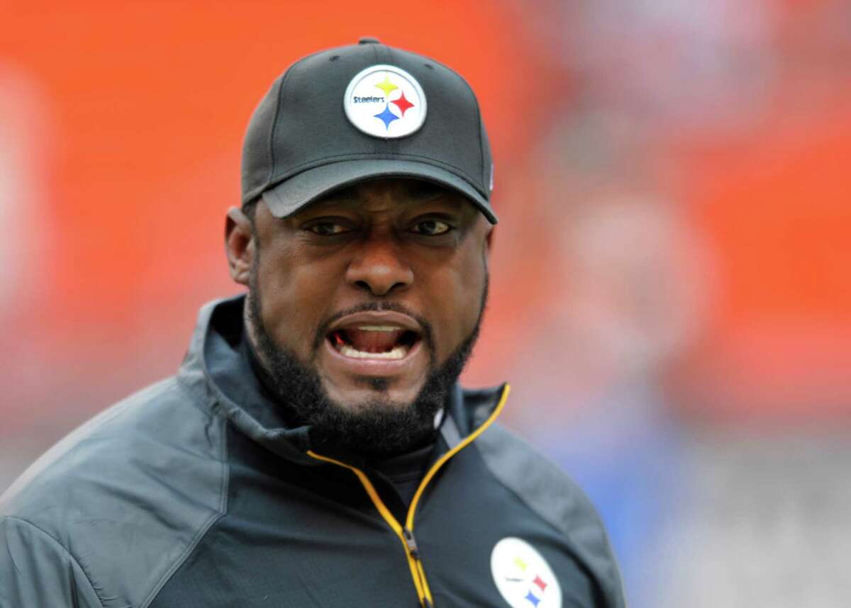 Pittsburgh Steelers head coach Mike Tomlin watches his team warm up before an NFL football game against the Cleveland Browns Sunday, Nov. 24, 2013. (AP Photo/David Richard)