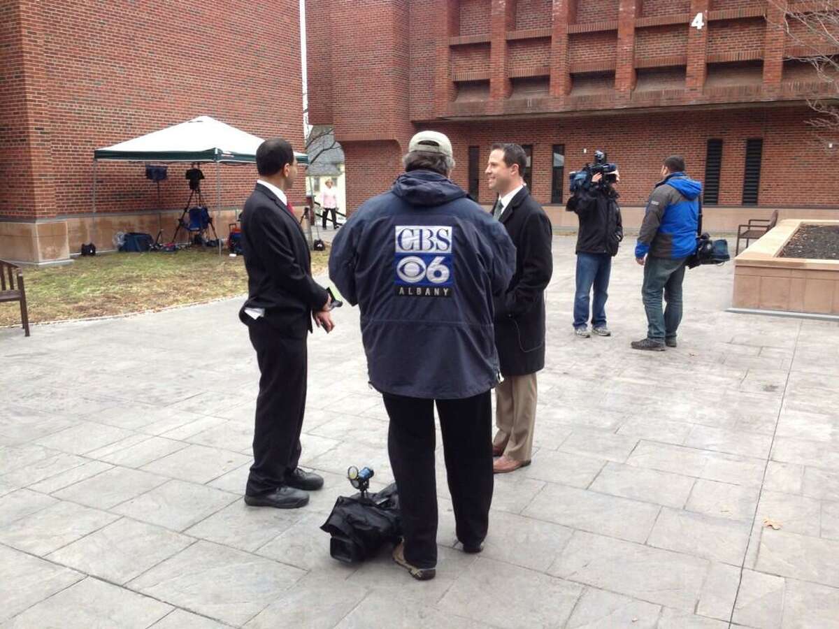 Members of the media gather outside of Saratoga County Court ahead of Thursday's sentencing for Dennis Drue, the driver from Halfmoon who caused a crash that killed two students from Shenendehowa High School and injured to others.