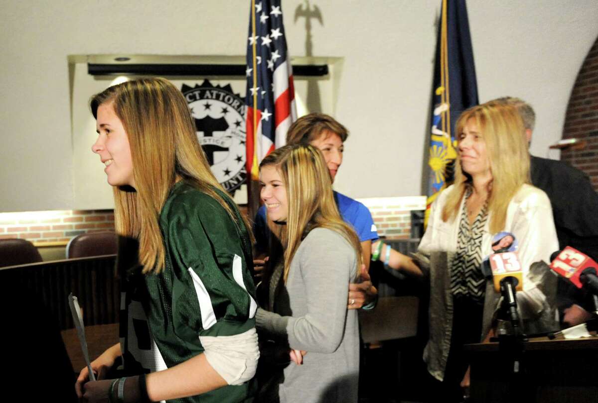 Crash victim Bailey Wind, left, exits a press conference following the sentencing of Dennis Drue Thursday, Dec. 5, 2013, in Ballston Spa, N.Y. Drue was sentenced to 5-15 years after pleading guilty to felony charges regarding the Northway crash which killed Chris Stewart and Deanna Rivers just over a year ago. (Michael P. Farrell/Times Union)