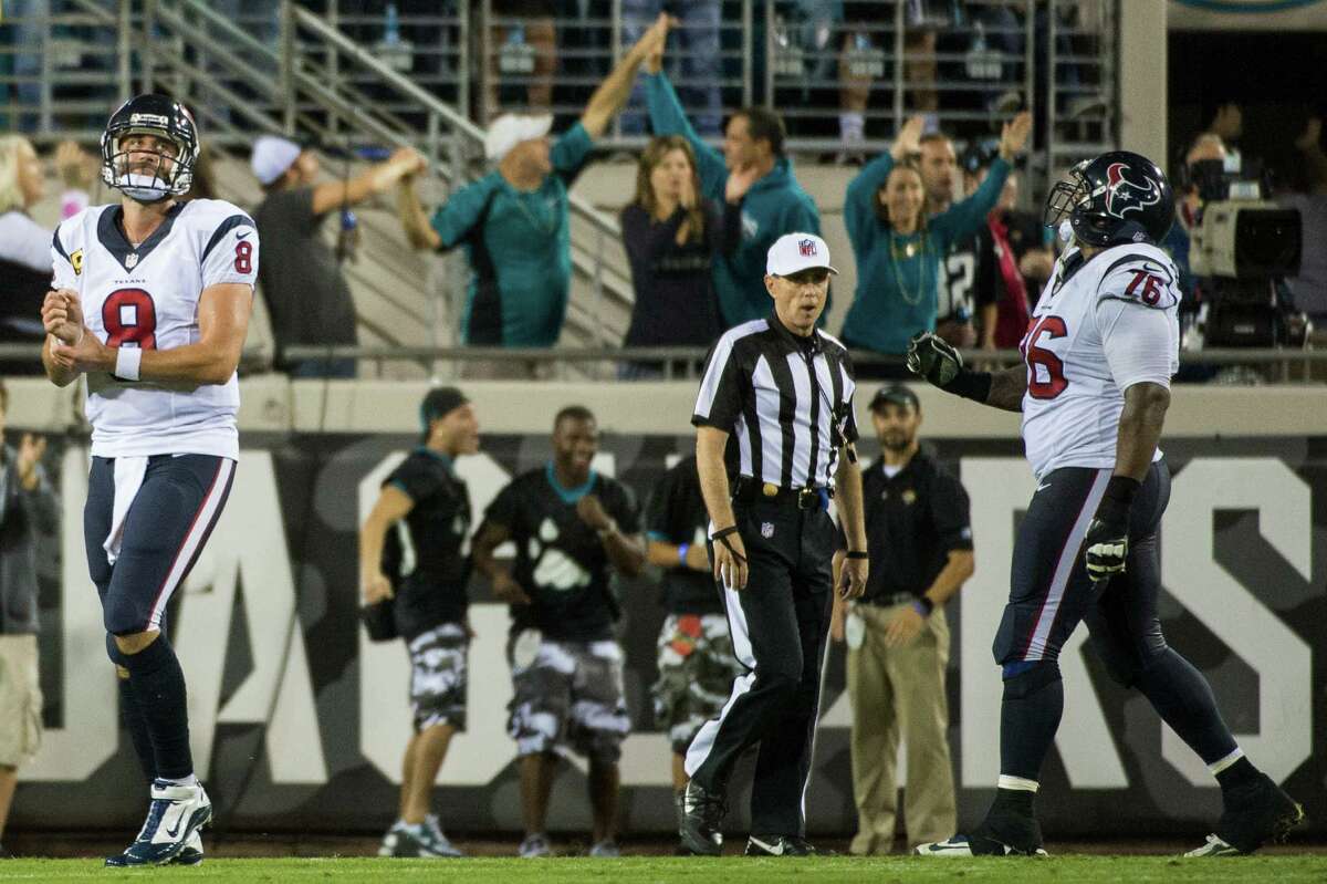 Matt Schaub (8), who replaced starting quarterback Case Keenum in the second half, dejectedly leaves the field after throwing a fourth-quarter interception that essentially sealed the Texans' fate.