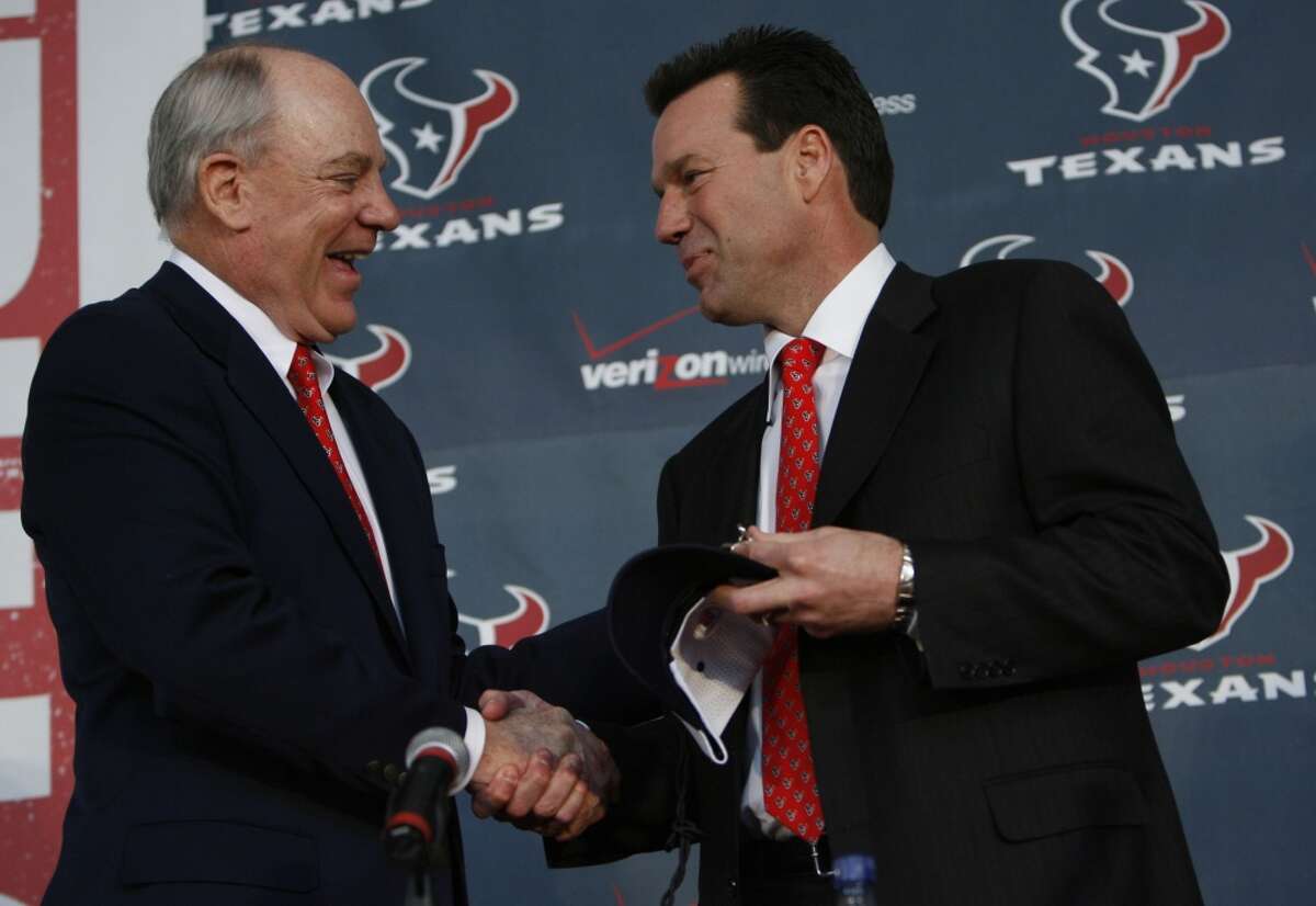 Gary Kubiak is introduced as the second head coach in Texans history on Jan. 26, 2006. Team owner Bob McNair shakes Kubiak's hand during the introductory news conference.