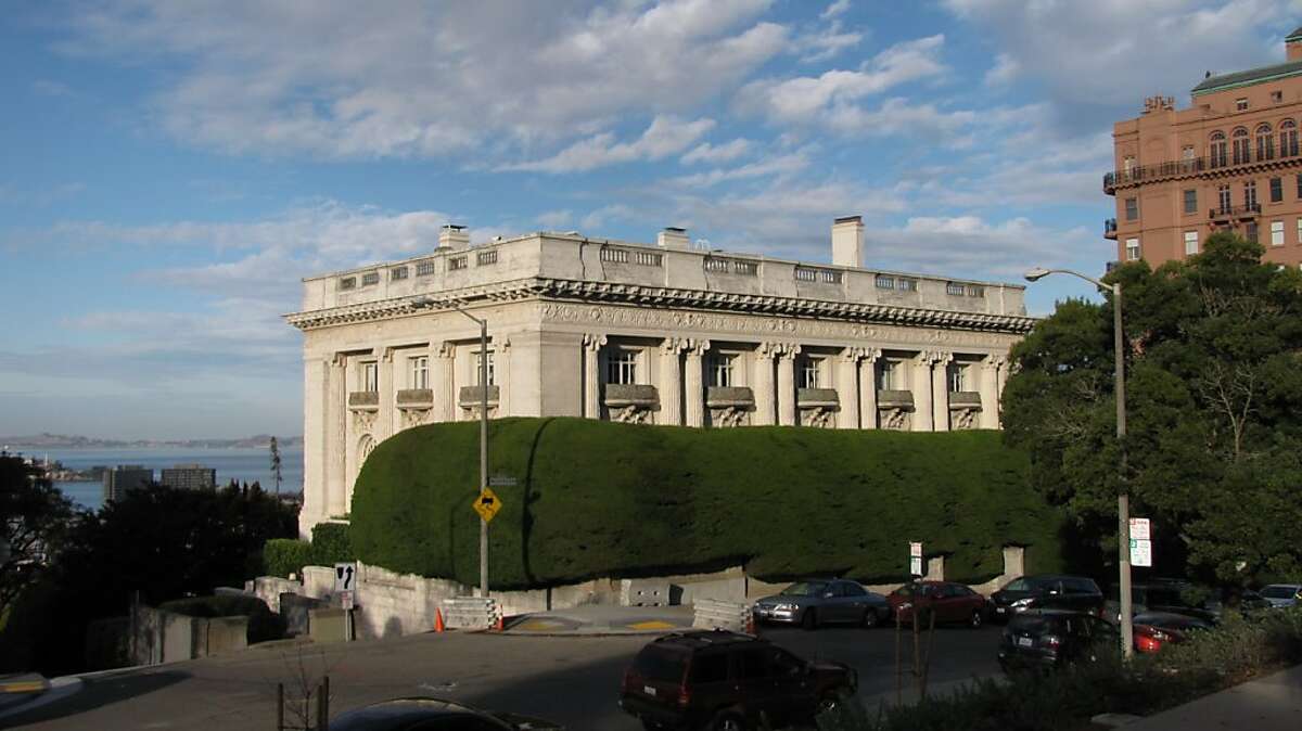 Spreckels Mansion's limestone is hidden by hedge