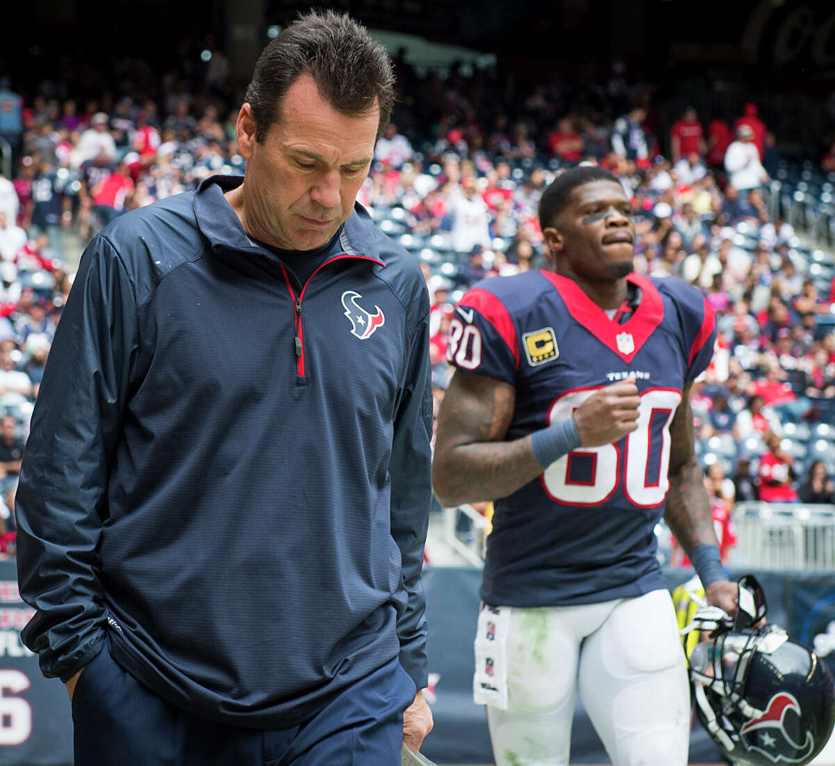Wide receiver Andre Johnson, right, will be walking out to the field with a new coach after nearly eight seasons of coming out of the tunnel with Gary Kubiak. ﻿